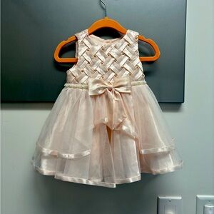 Beautiful pink rare editions dress with tutu skirt and pearl detail.  3-6 mo